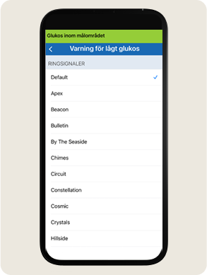 En smartphonesk&auml;rm visar en &rdquo;L&aring;gt glukos-varning&rdquo;-sida med alternativ f&ouml;r ringsignaler